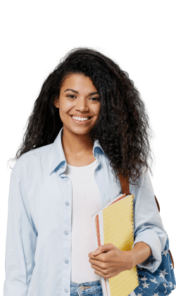 Smiling student holding notebooks