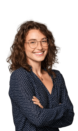 Smiling woman with glasses and folded arms