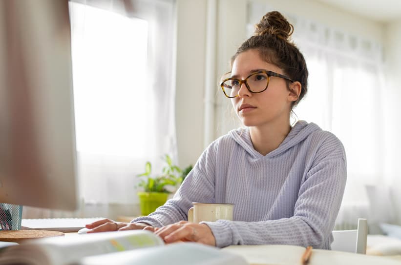 Student concentrating while working at her computer